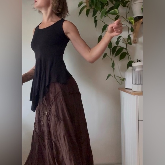 Plenty Asymmetrical Black Tank Top
Fits Small - Picture 5 of 6